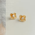Gold Textured Flower Pearl Center Stud Earrings Pair view 1