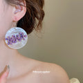 Asymmetric Purple Floral Disc Drop Earrings with Reflective Details view 3