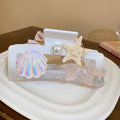 Twelve Mixed Hair Claw Designs With Pearls Flowers Stars And Bows view 8