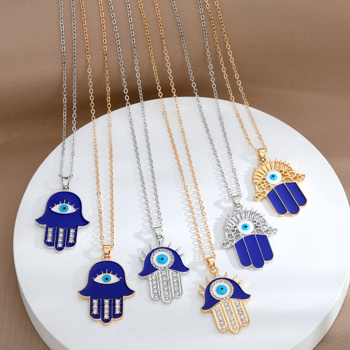 Gold and Silver Tone Blue Crystal Hamsa Eye Pendant Necklaces