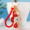 Jeweled Ball Holding Mouse Keychains with Braided Loops and Six Faux Fur Pom Colors view 1