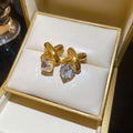 Gold Tone Crossed Bar and Cube Drop Earrings in Two Colors view 6