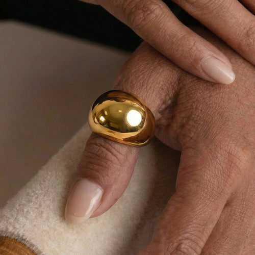 Styled hand view of domed geometric rings in main image 2.