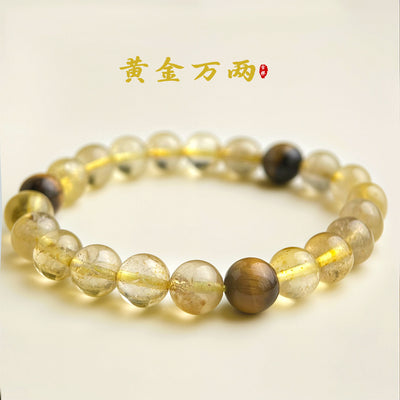 Yellow rutilated quartz bead bracelet with tiger eye on cream