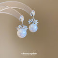 Crystal Bow and Pearl Drop Stud Earrings Fashion Earrings view 1