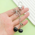 Butterfly Charm Keychains Featuring Black Cherry Across 31 Pictured Variations view 2