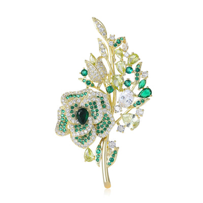 Front view of crystal rose bouquet brooch with leafy stem decorative metal pin