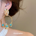 Turquoise Bead Floral Hoop Drop Earrings with Polished Metal Tone Details view 3