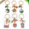 Four Camping Car Tent and Palm Tree Metal Keychain Designs view 2