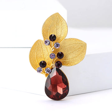 Three Textured Leaf Brooch With Large Burgundy Teardrop Crystal