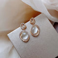 Gold Tone Oval Cat Eye Crystal Double Hoop Earrings view 2