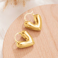 Gold and Silver Tone Heart Huggie Earrings Polished Jewelry Accessory view 5