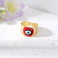 Gold Tone Wide Cuff Smiley and Lash Eye Adjustable Rings view 2