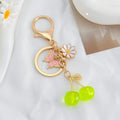 Cherry Charm Keychain with Enamel Butterfly and Daisy Flower Pendant view 8