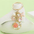 Starfish, Conch and Shell Charm Keychains Featuring Blue Shell Across 59 Variations view 3