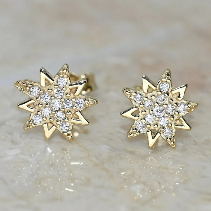 Gold Tone Eight Point Star Stud Earrings With Clear Stones