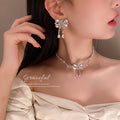 Silver Tone Crystal Bow Drop Earrings Or Matching Necklace view 1