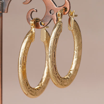 Front product view of the elongated rounded hoops with a subtly uneven surface