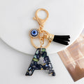 Shell-Chip Resin Letter Keychain with Evil Eye Charm and Tassel view 2