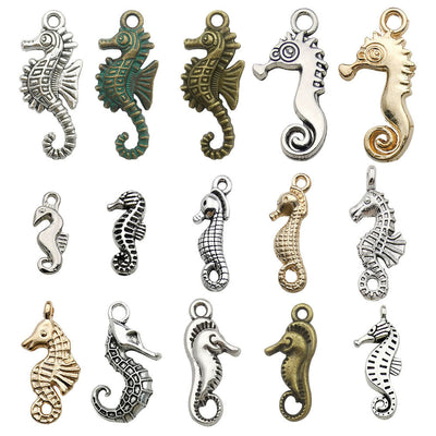 Metallic seahorse charms arranged on a light background