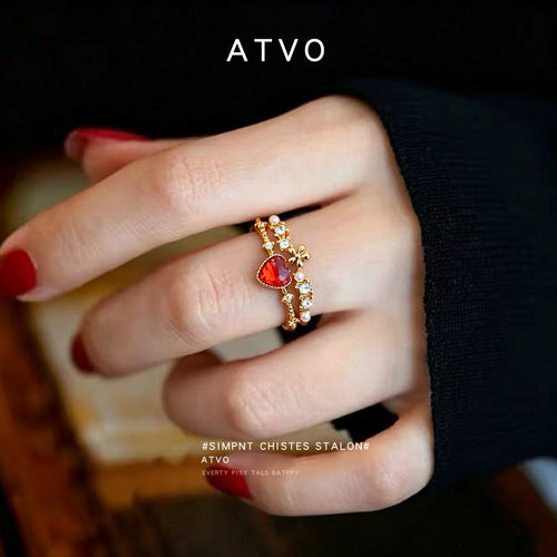 Gold red heart adjustable ring worn on finger with red nails
