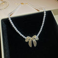 Pearl Strand Bow Pendant Necklace With Decorative Accents view 3