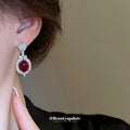 Silver Tone Crystal Oval Drop Earrings With Glossy Red Centers view 3