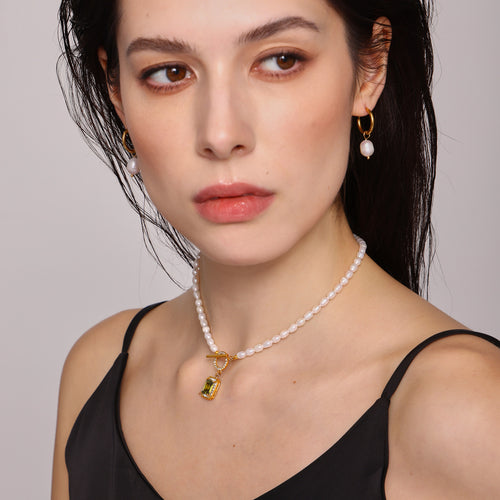Close face view of olive square zircon pearl choker on model