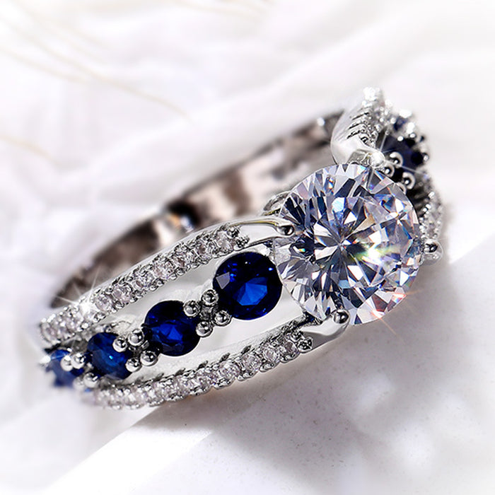 Round Clear Solitaire Split Band Ring With Blue Side Stones