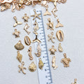 Gold-Tone Shell and Starfish Shell Charms with 29 Listed Options view 3