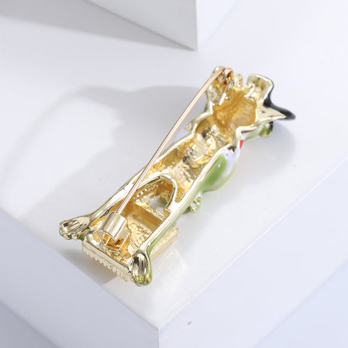 Close-up product view showing the colors and surface details of the green frog brooch