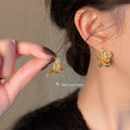 Gold Hammered Double Flower Stud Earrings Clear Crystal Centers view 2
