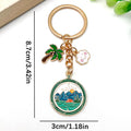Four Green Camping Mountain and Palm Tree Metal Keychain Designs view 4