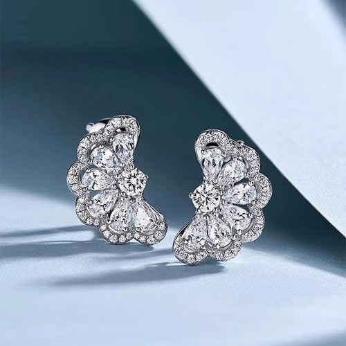 Second product view showing silver-tone crescent floral clear-stone cluster stud earrings