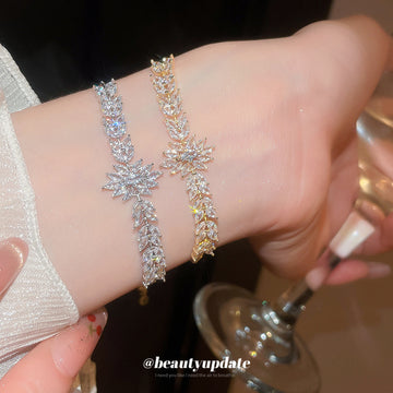Crystal Leaf Adjustable Bracelet In Gold And Silver