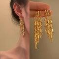 Gold Tone Layered Leaf Cluster Long Tassel Hoop Earrings view 1