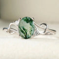 Green Patterned Oval Stone Infinity Ring In Silver Tone view 1