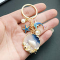 Blue Dolphin Starfish Shell and Faux Pearl Ocean Charm Keychain view 2