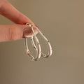 Textured Oval Hoop Earrings in Gold and Silver Tones view 4