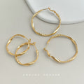 Gold Tone Twisted Texture Round Hoop Earrings In Two Sizes view 1