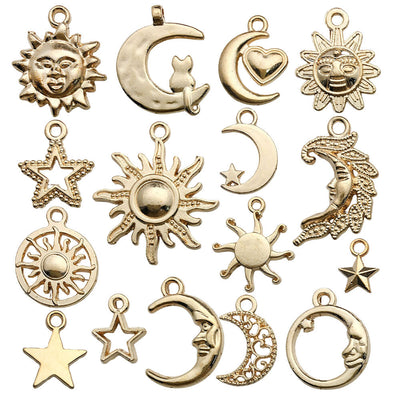 Yellow sun and moon charms arranged on a light background