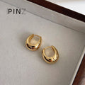 Polished Oval Huggie Hoop Earrings In Gold Silver And Three Sizes view 10