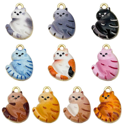 Orange cat charms arranged on a light background