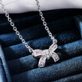Silver Tone Bow Pendant Necklace With Clear Stones view 1