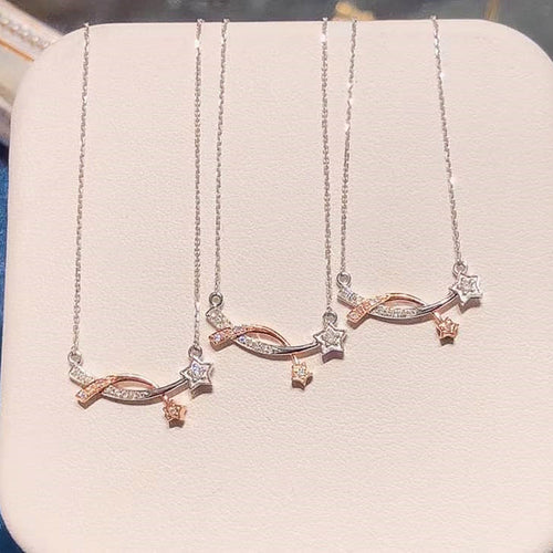 front view of two-tone necklace with linked silver and rose gold-tone stars