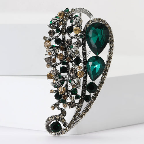 Angled display of the brooch showing its raised decorative details