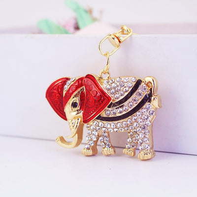 Red-accented elephant keychain covered in clear faceted stones.