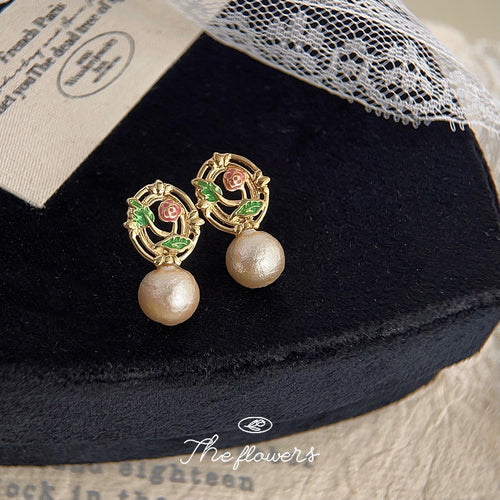 Gold enamel rose cotton pearl drop earrings on black velvet box
