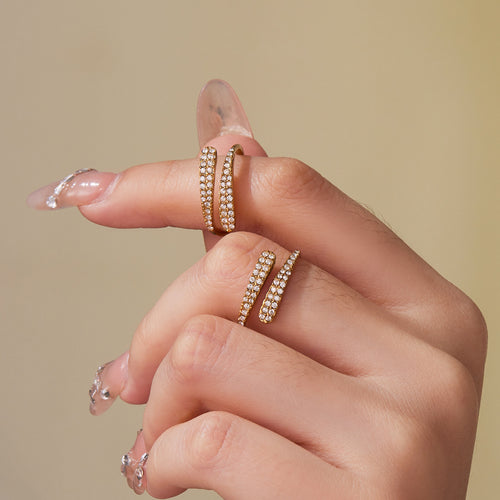 Model wearing two gold double-row zircon open bypass rings
