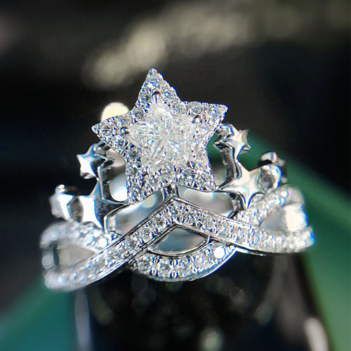 Front view of star crown ring with side stars and crossed band